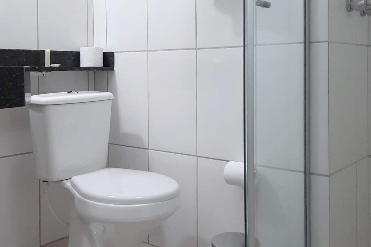 deluxe double room single use | bathroom | shower, rainfall showerhead, designer toiletries, hair dryer