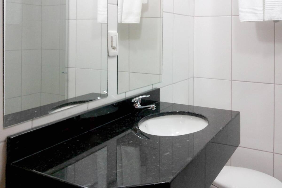 deluxe triple room | bathroom | shower, rainfall showerhead, designer toiletries, hair dryer