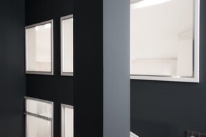 A room with a dark wall, a large window, and a door. - Weimar Central Artist Loft (Weimar)