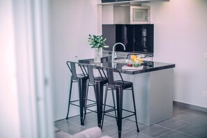 Fridge, microwave, stovetop, coffee/tea maker