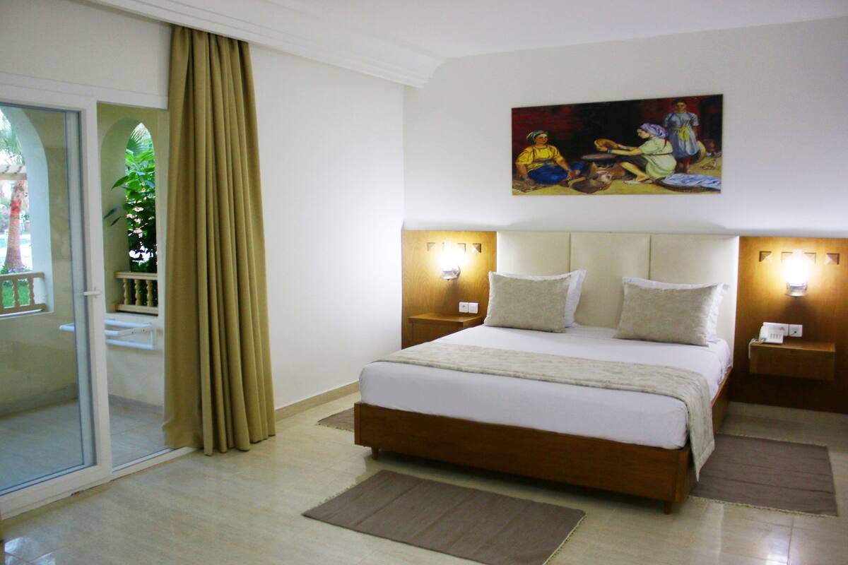 Suite ejecutiva | Cortinas opacas y ropa de cama