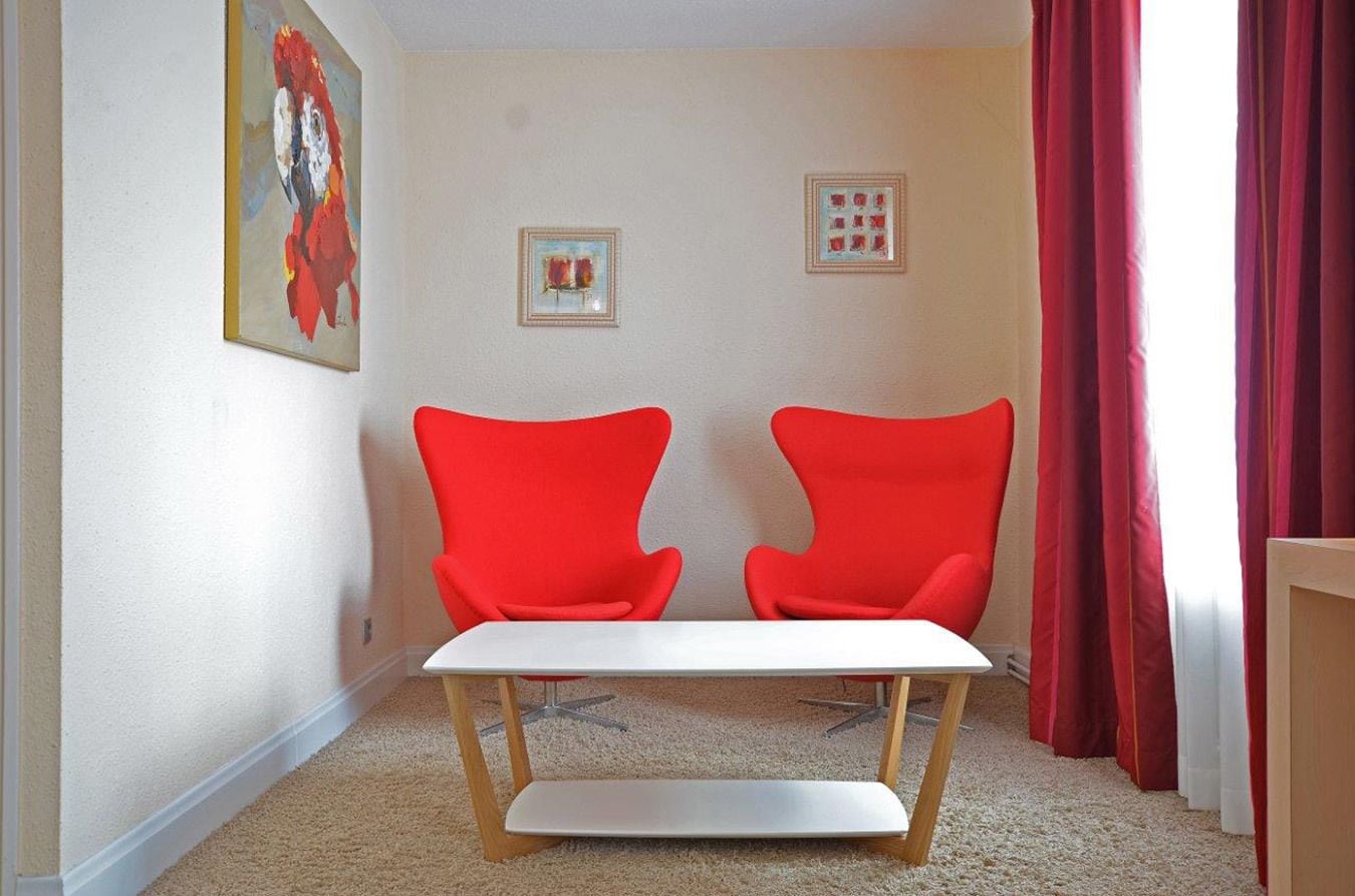 double room, lake view | living room | flat-screen tv