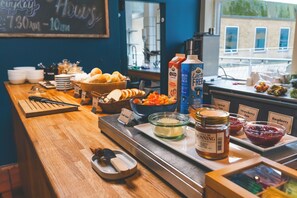 A breakfast buffet with various food items and condiments. - Danhostel Aarhus City (Aarhus)