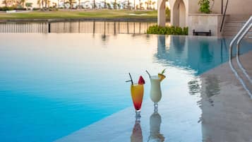 Seasonal outdoor pool, open 11:00 AM to 7:00 PM, pool umbrellas