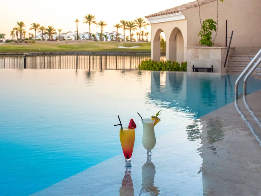 Seasonal outdoor pool, open 11:00 AM to 7:00 PM, pool umbrellas