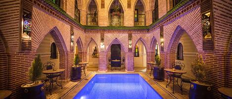 Indoor pool, pool umbrellas, sun loungers