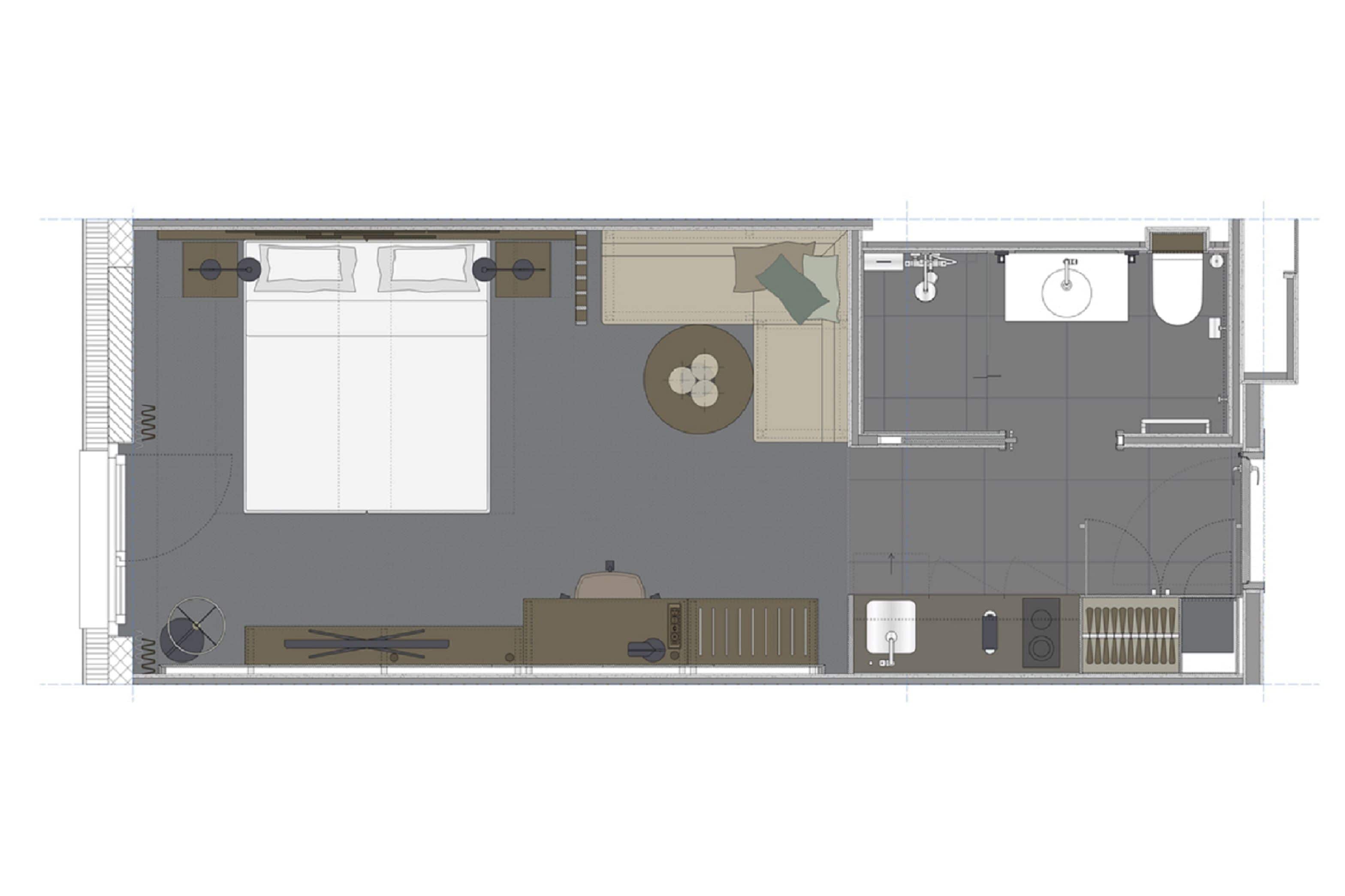 A hotel room layout with a large bed, a desk, a chair, a small table, a sofa, a circular seating area, a bathroom with a toilet and sink, and a shower area.