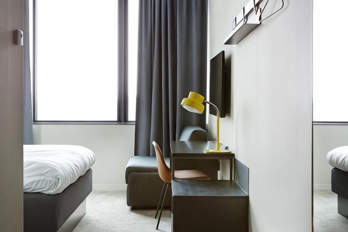 Desk, laptop workspace, bed sheets