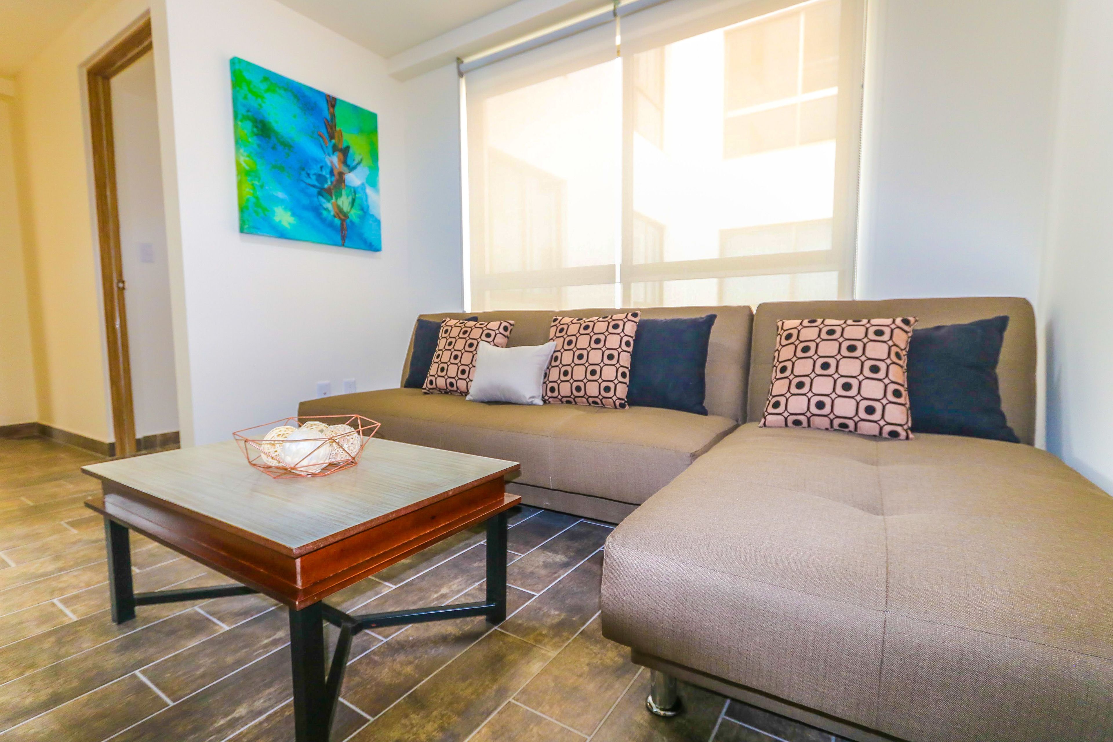 Departamento, 1 habitación | Área de sala de estar | Televisión de pantalla plana de 36 pulgadas con canales por cable 