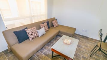 Apartamento Duplex | Area keluarga | Televisi layar datar 36-inci dengan saluran TV kabel, TV, dan Netflix