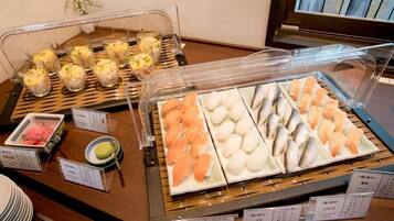 A buffet with various seafood dishes, including sushi and sashimi, displayed in clear containers.