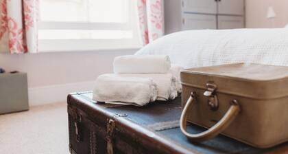 Cottage familial prÚs des plages, jardin, chiens bienvenus, WiFi Smart TV, lit bébé chaise haute