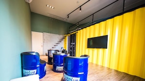 A room with a wooden floor, a staircase, and a yellow wall. - Urban (Kaohsiung)