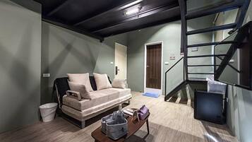 Comfort Quadruple Room (Starbucks) | Living area | Flat-screen TV