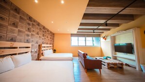 A hotel room with two beds, a wooden headboard, a television, and a wall decorated with certificates. - Urban (Kaohsiung)