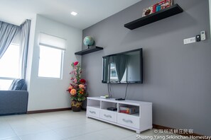 Apartment, 3 Bedrooms | Living area | Flat-screen TV