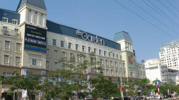 A large hotel with multiple floors and a prominent sign for 'The Garden'.