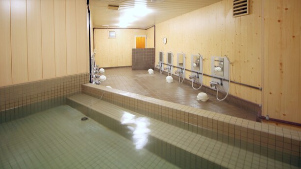 A public restroom with a tiled floor, a sink area, and a shower stall. - Hotel LC Gifu-Hashima (Hashima)