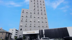 A multi-story building with a modern design, featuring numerous windows and air conditioning units. - Hotel LC Gifu-Hashima (Hashima)