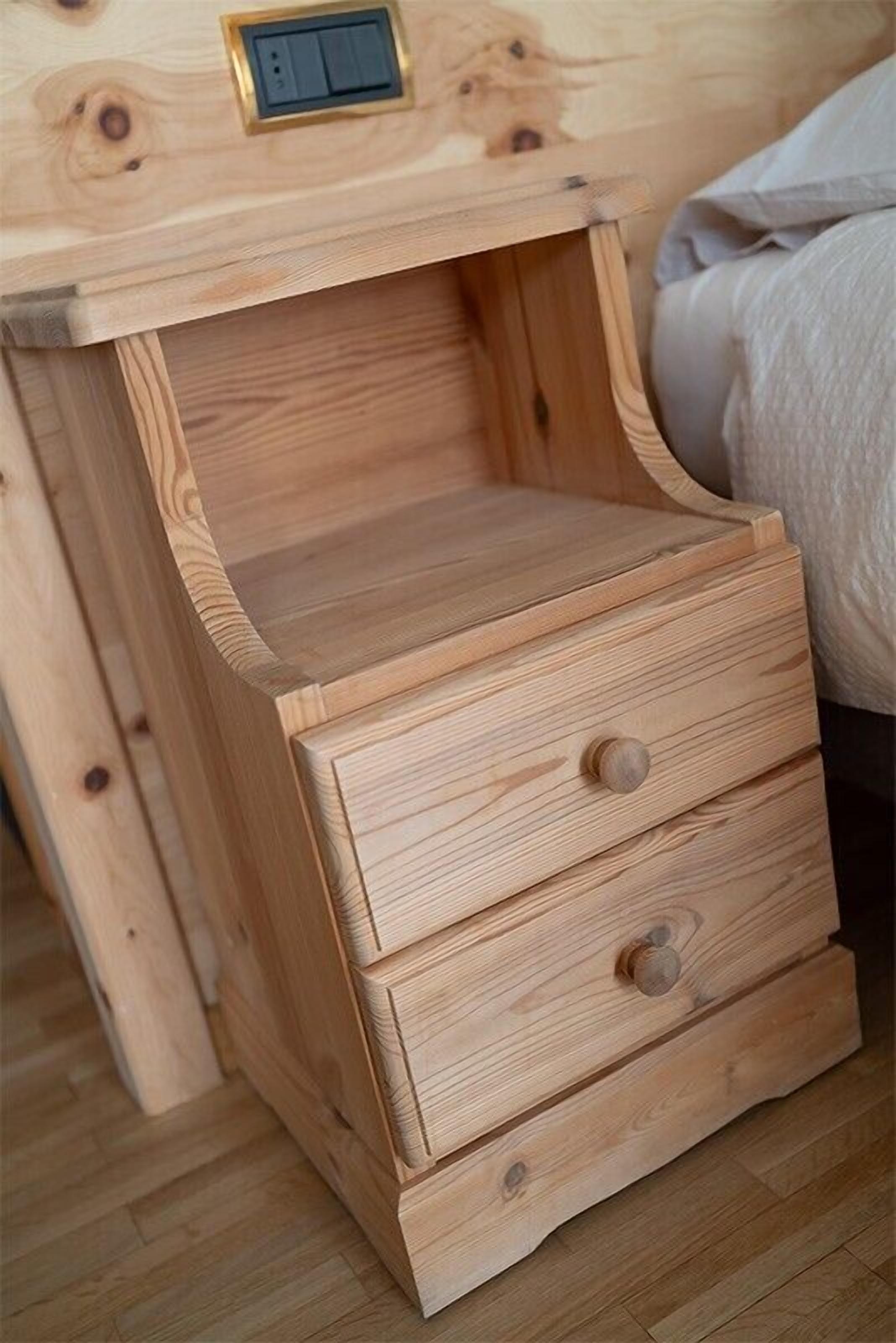 A wooden bedside table with a drawer and a switch.