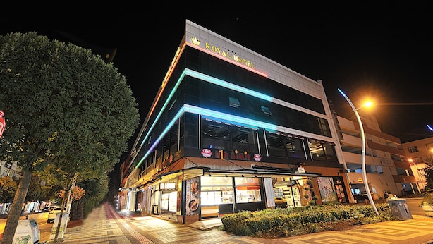 A hotel with a modern design, featuring a prominent sign and illuminated signage. - Inegol Royal Hotel (Inegol)