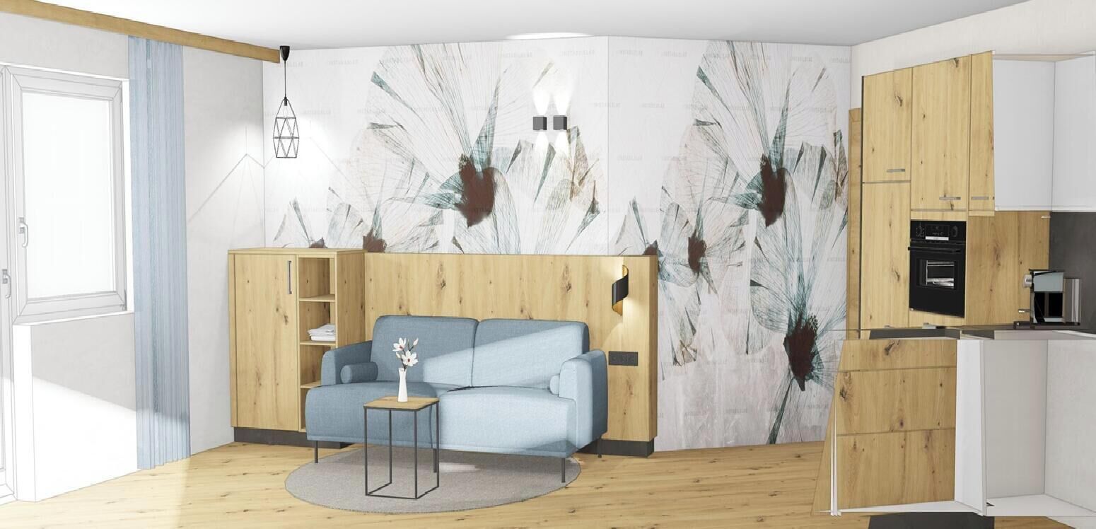 A modern living room with a sofa, a small table with a vase, a wooden cabinet, and a kitchen area with a stove.