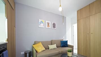 Apartment, 1 Bedroom, Ground Floor | Living area | 60-cm TV with cable channels