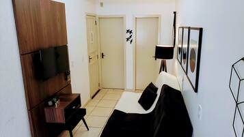 Family Apartment, 1 Bedroom | Living area | 32-inch Smart TV with cable channels, TV, Netflix