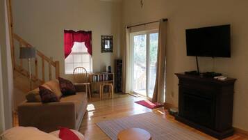 Oakview Cabin, Non Smoking | Living area | Flat-screen TV, fireplace, DVD player, toys