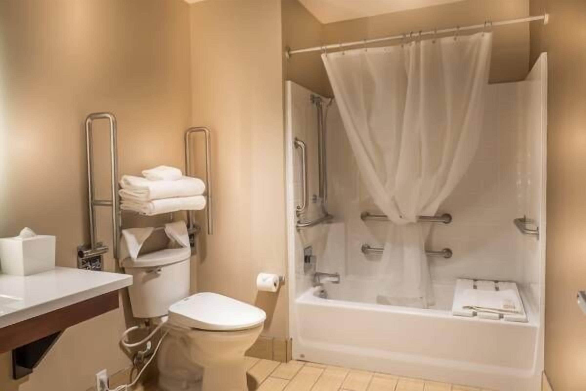 classic studio, 1 king bed | bathroom | shower, free toiletries, towels
