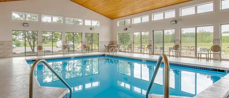 Indoor pool, open 7:00 AM to 11:00 PM, pool loungers