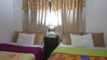 Double Room | Down comforters, individually furnished, blackout drapes, free WiFi