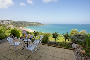 Private sea terrace leading onto gardens