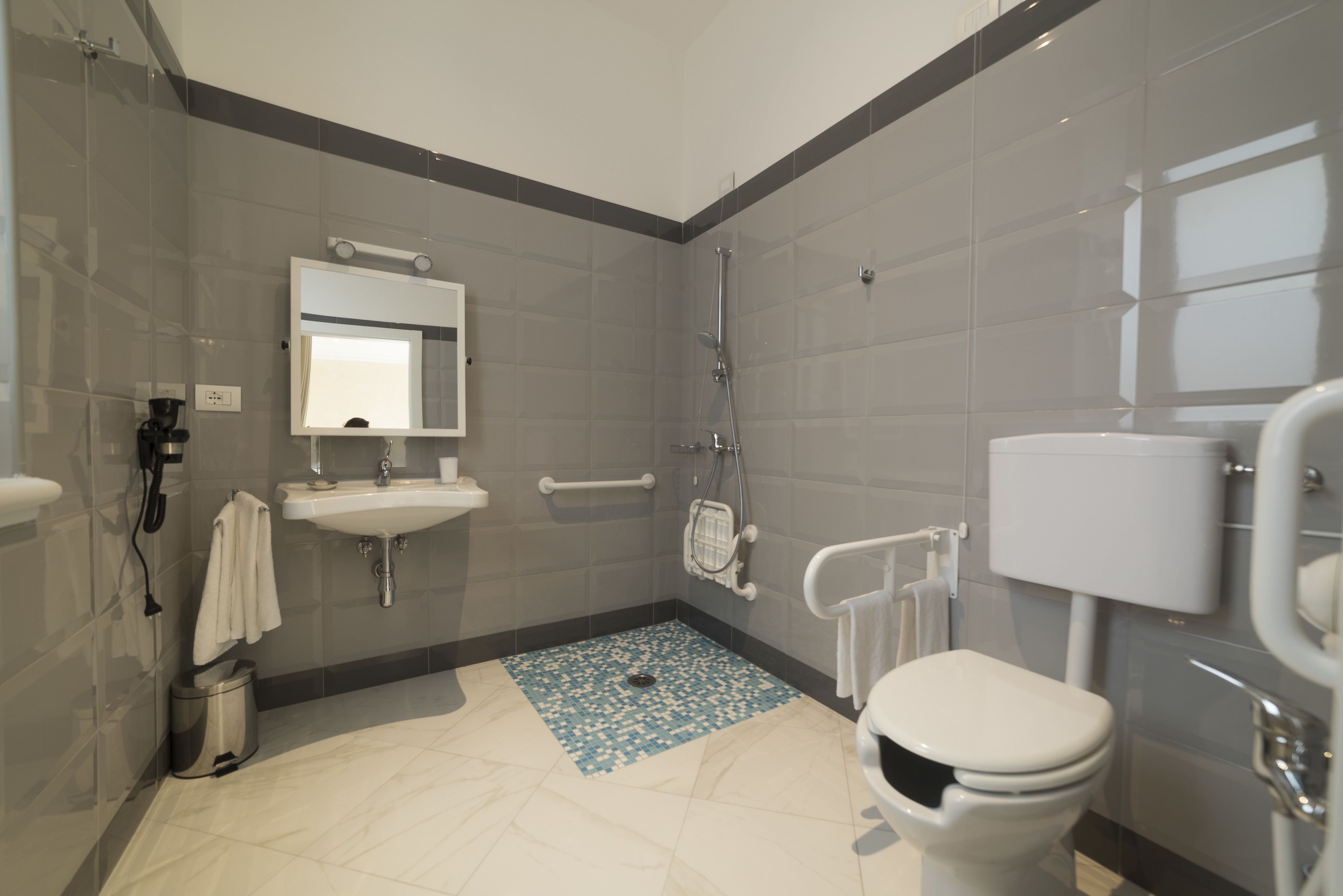 classic twin room, accessible | bathroom | free toiletries, hair dryer, slippers, towels