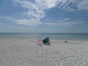 On the beach, sun loungers, beach towels