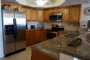 Beautiful wood cabinets with granite counters & stainless steel appliances.