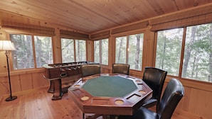 A wooden room with a poker table, chairs, and a foosball table. - White Water River Cabin near Helen, GA-Kayak, tube, fish, hike, in wine country (Cleveland)