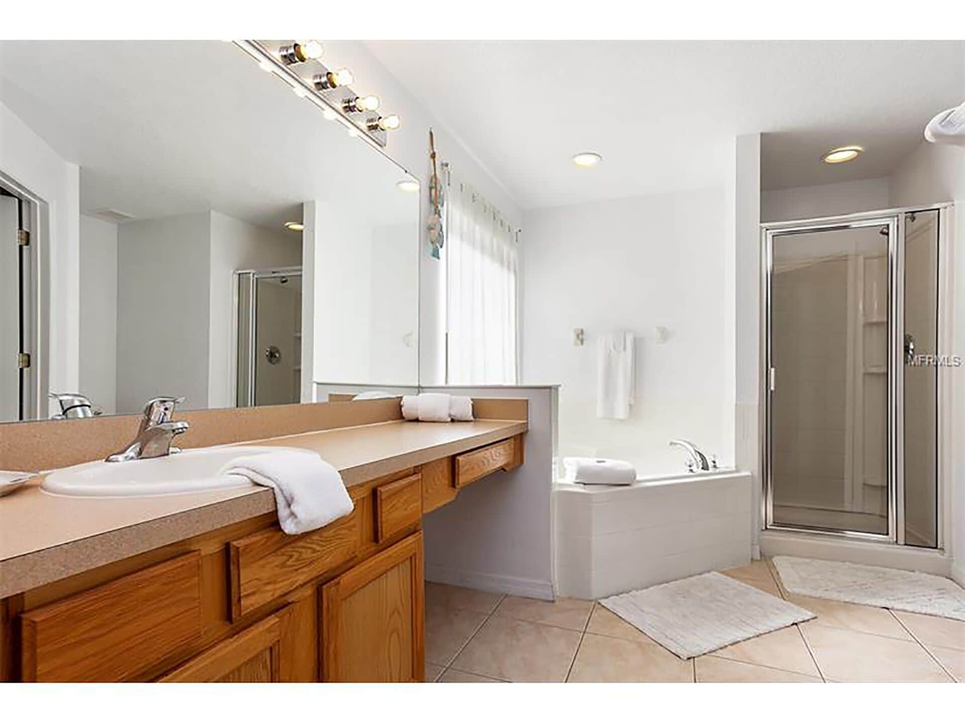 Combined shower/bathtub, hair dryer, towels, soap