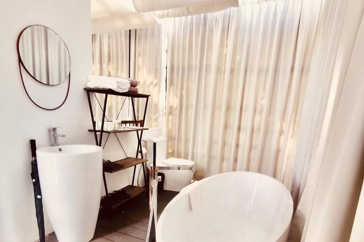 beach front suite | bathroom | slippers, towels