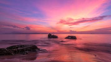 Enjoy a serene beach experience with a clear view of the sea.