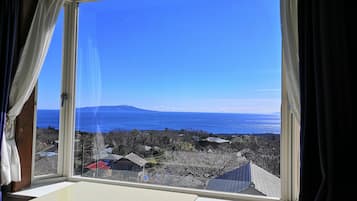 Triple Room, Ocean View | Desk, blackout drapes, soundproofing, iron/ironing board
