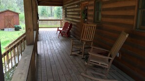 A wooden cabin with a porch, rocking chairs, and a welcome sign. - Beautiful Creekside Cabin 3 Bedroom Robbinsville, NC Perfect Family Location! (Robbinsville)