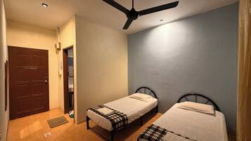 Desk, iron/ironing board, bed sheets