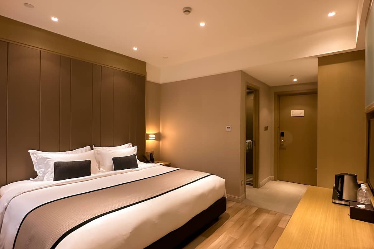 business queen bed | premium bedding, desk, blackout curtains, soundproofing