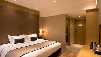 Business Queen Bed | Premium bedding, desk, blackout drapes, soundproofing