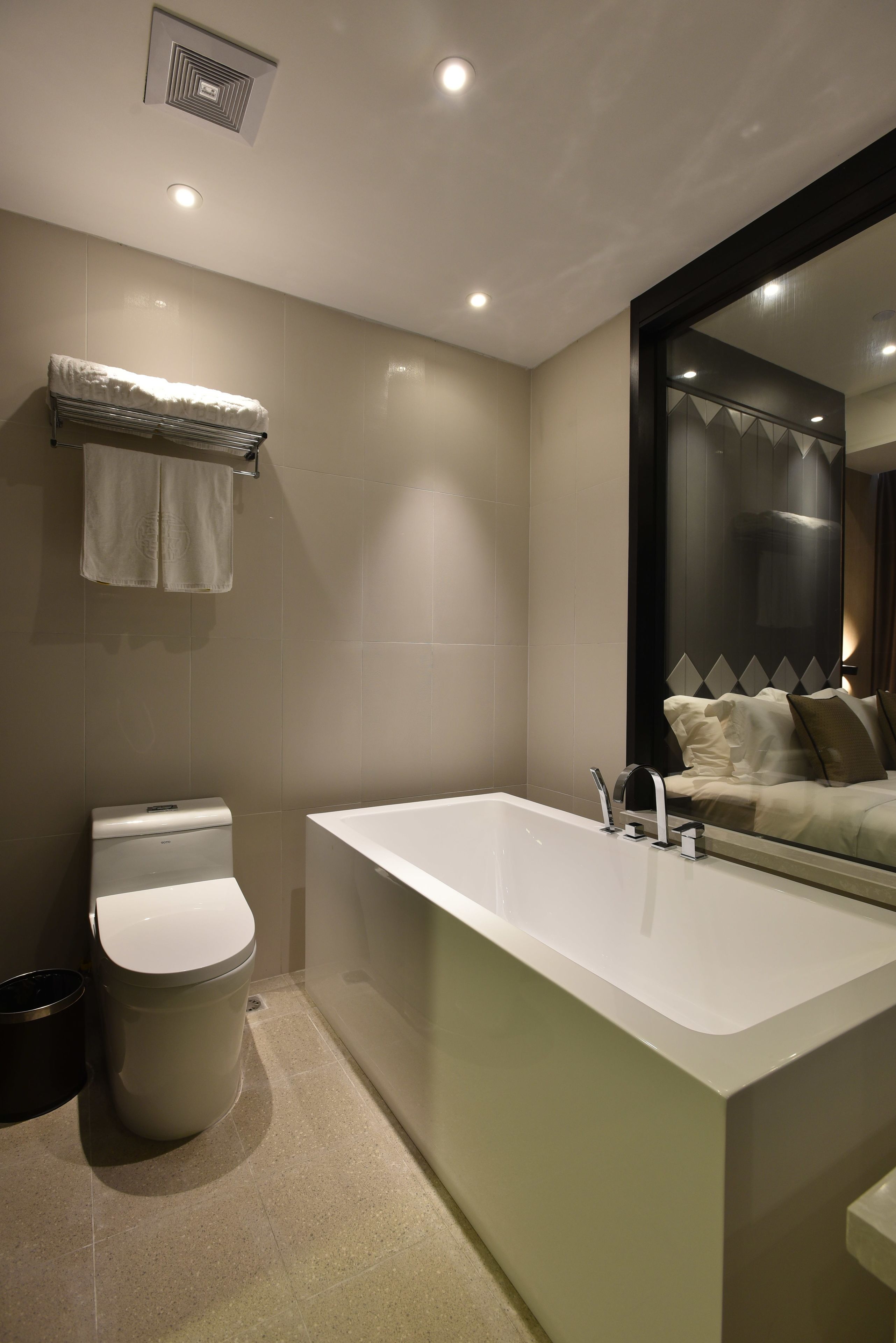 deluxe queen bed | bathroom | free toiletries, hair dryer, bathrobes, slippers