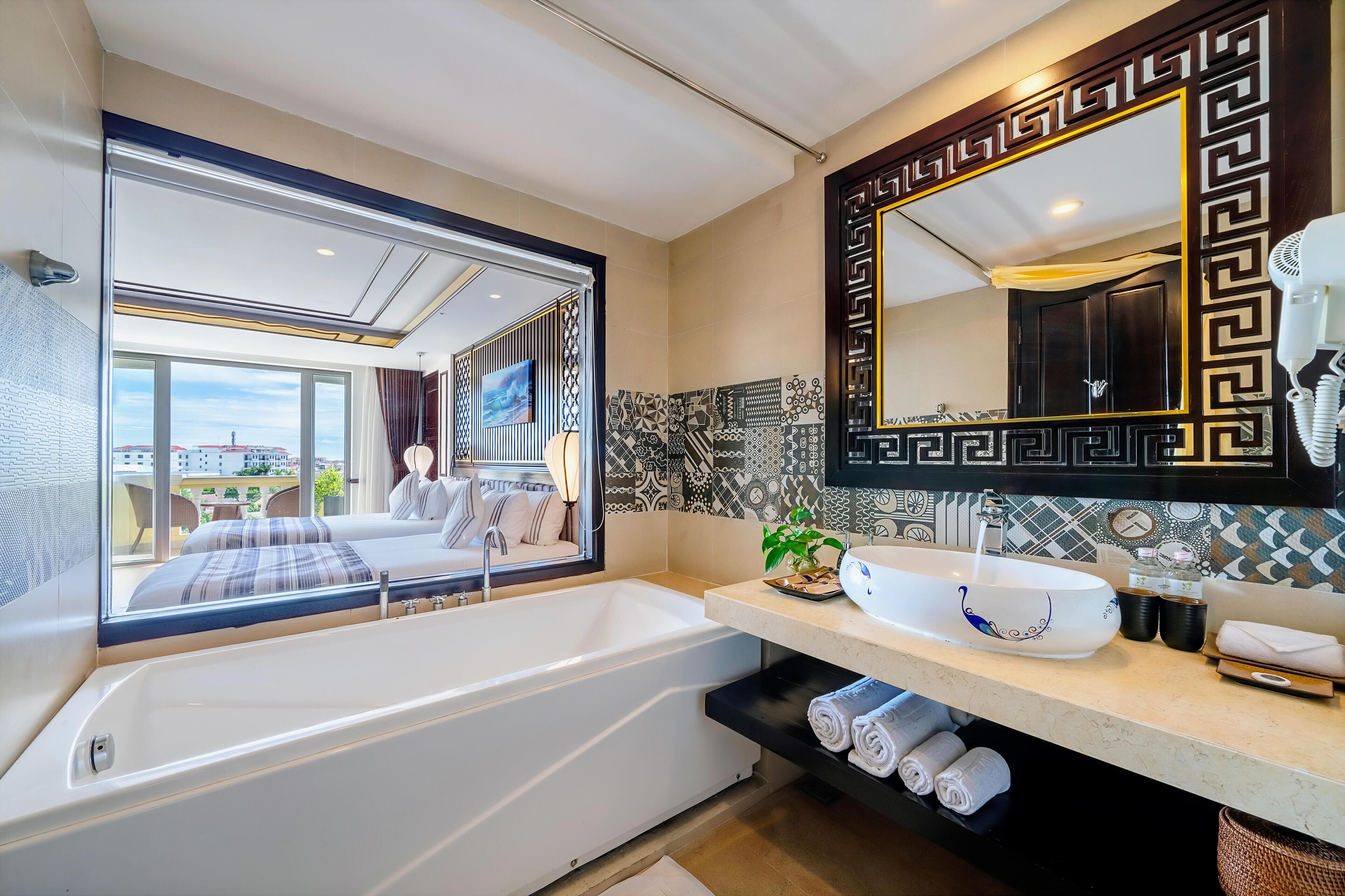 premium deluxe palm view balcony | bathroom | free toiletries, hair dryer, bathrobes, slippers