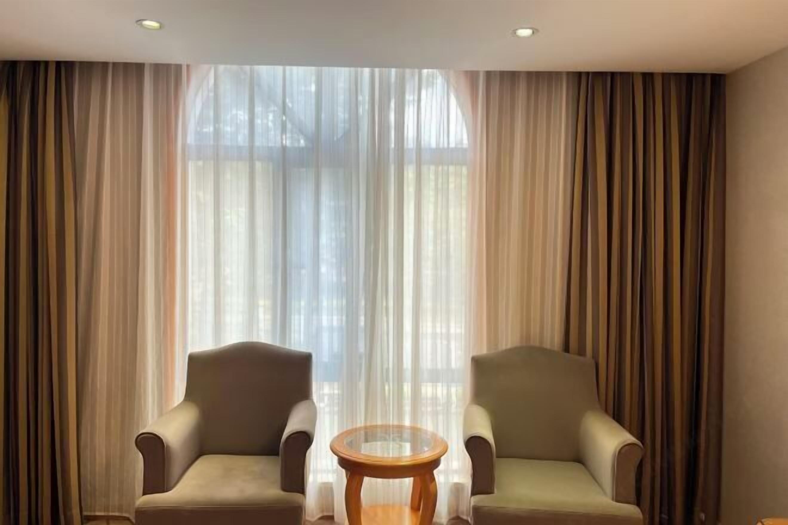 Desk, blackout drapes, iron/ironing board, rollaway beds
