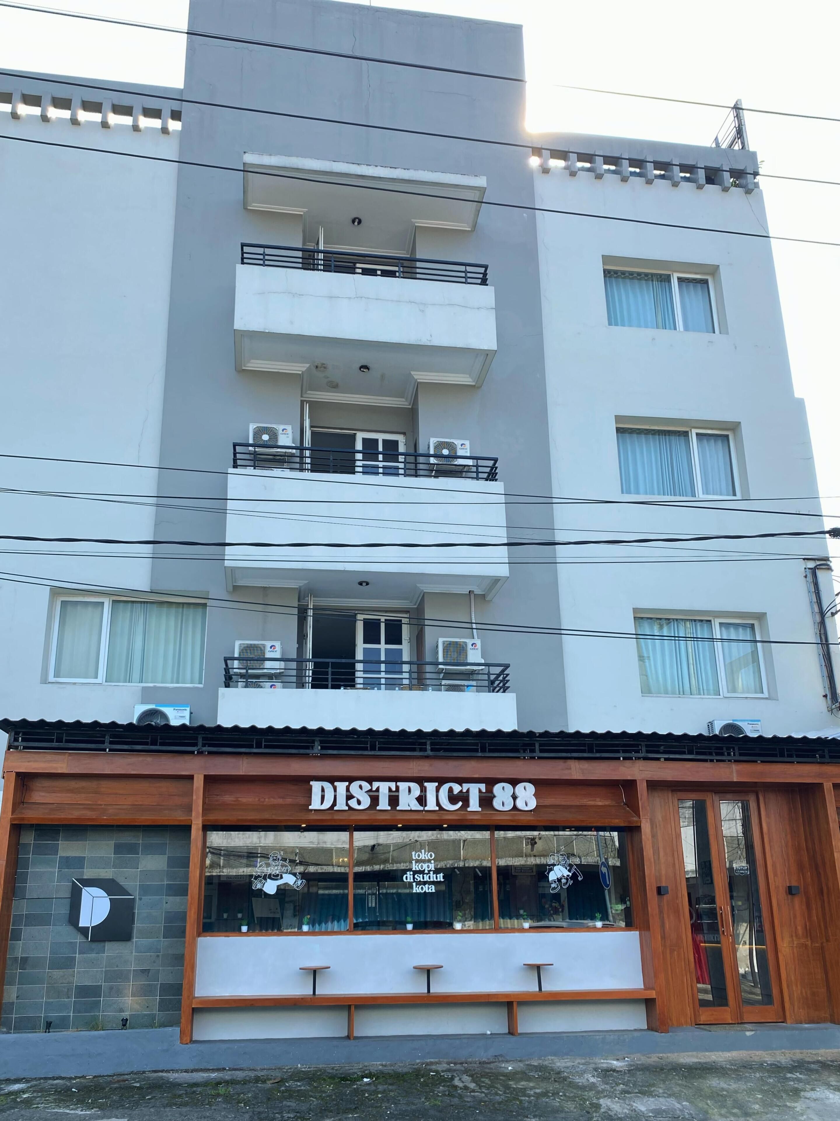 A multi-story building with a sign reading "DISTRICT 88" at the ground level.