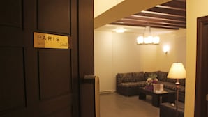 A hotel room with a sign reading "PARIS Suite 301". - Aley Suites (Aley)